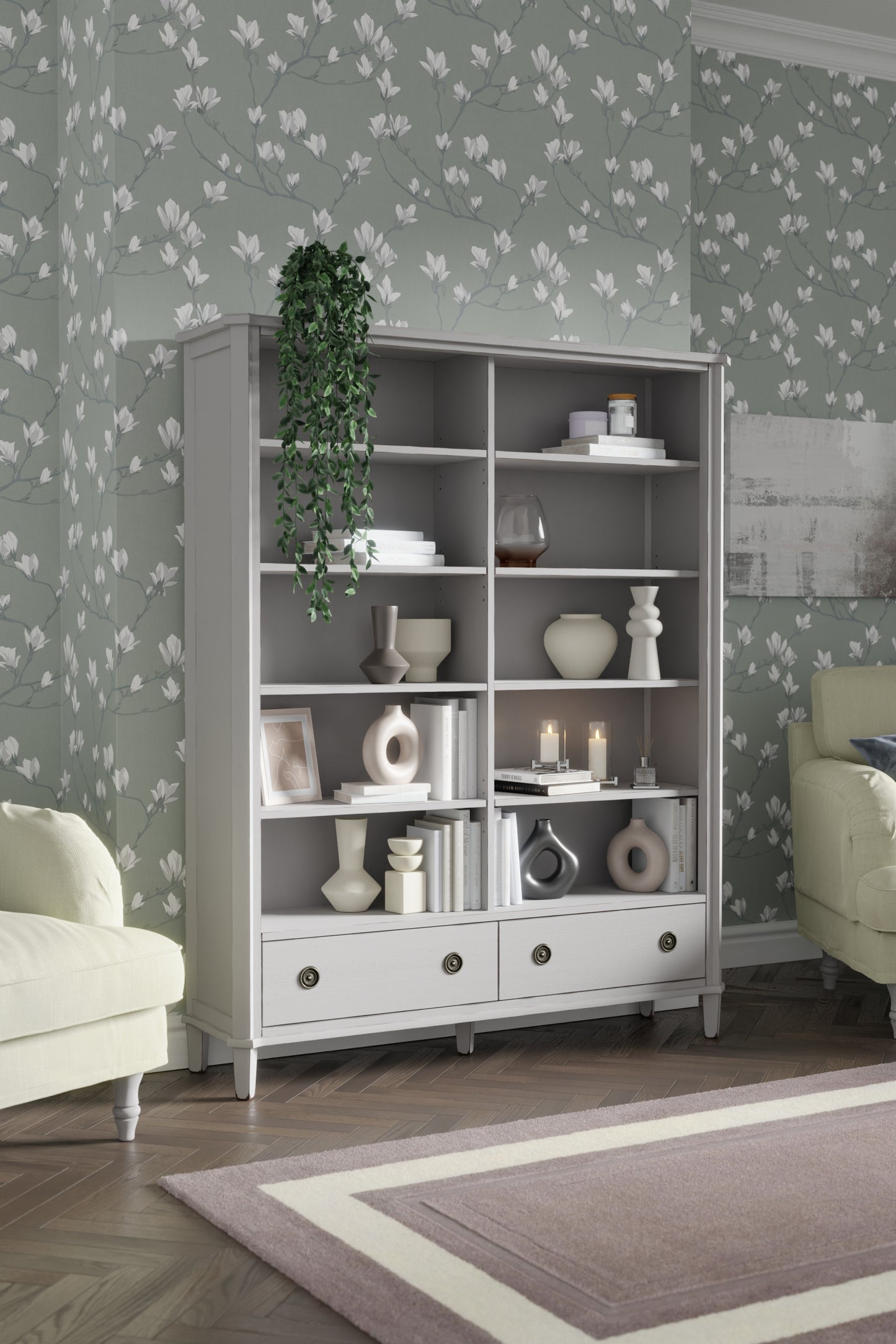 Light grey double bookcase with decorative items against a floral wallpapered wall.
