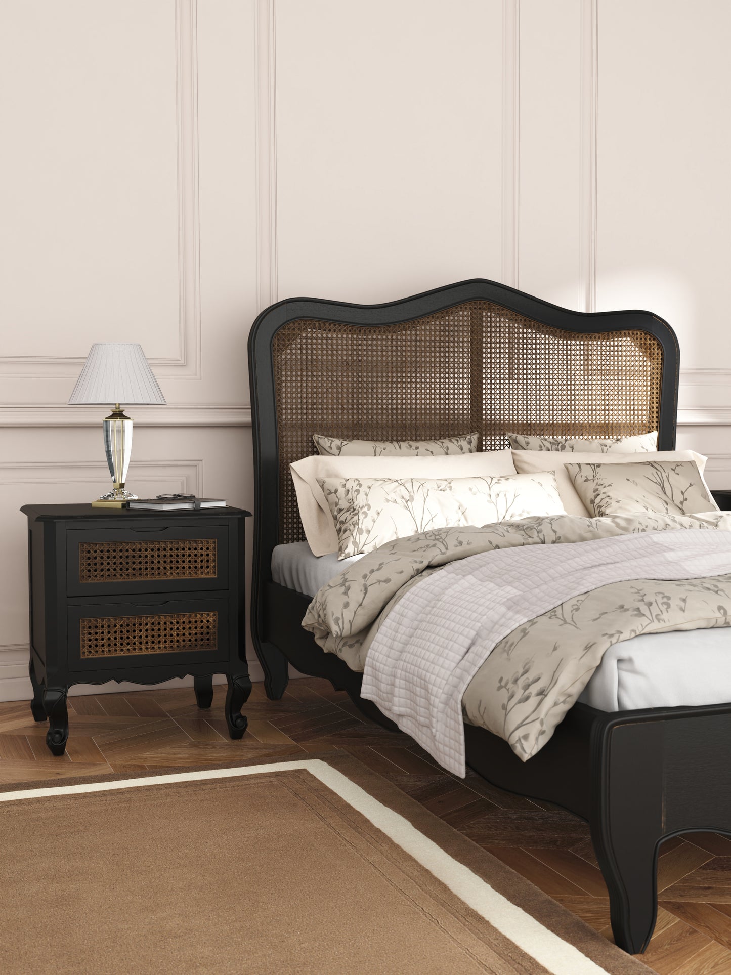 Bedroom with a bed and nightstand featuring wicker design.