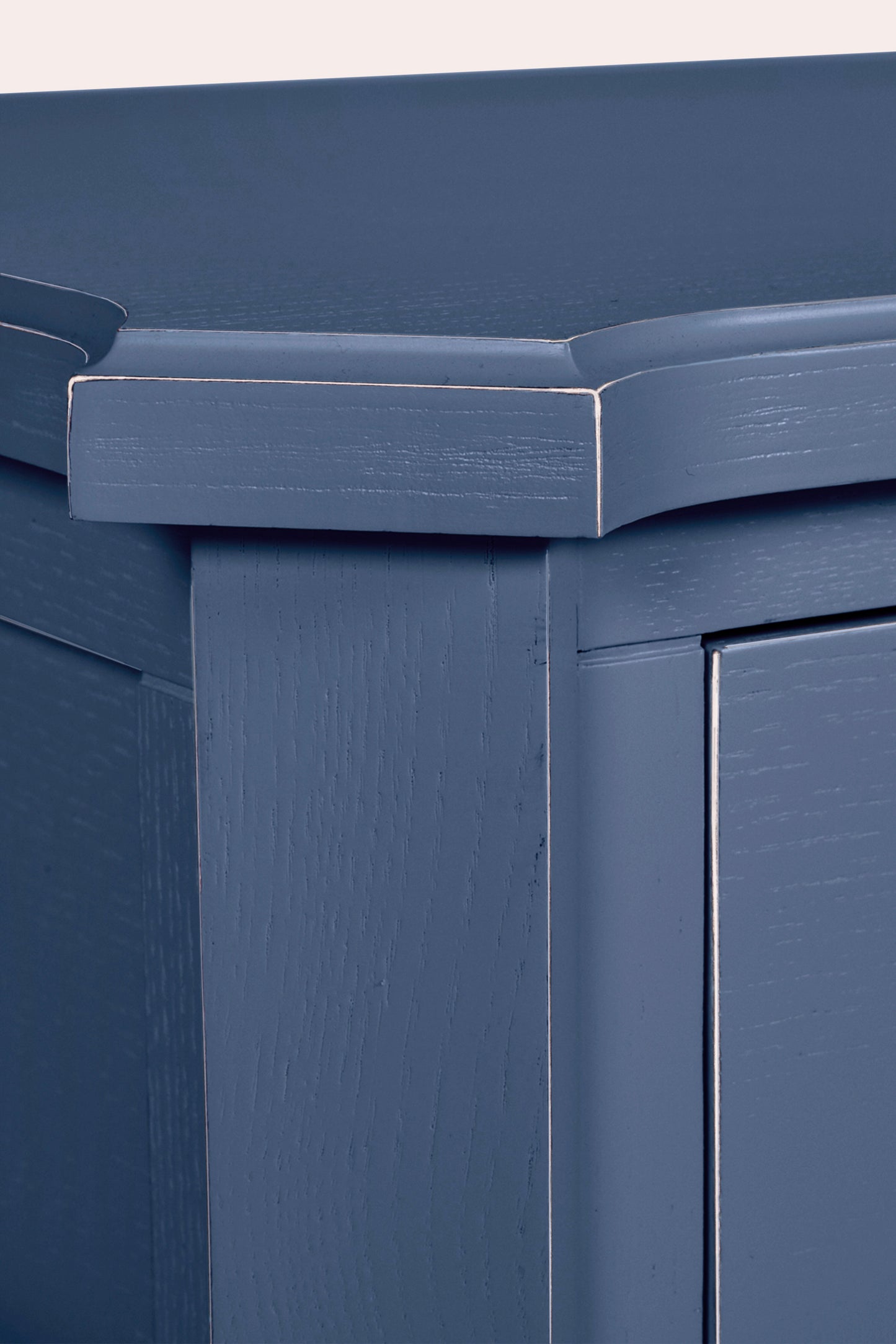 Close-up of a blue storage bin with a metallic handle.
