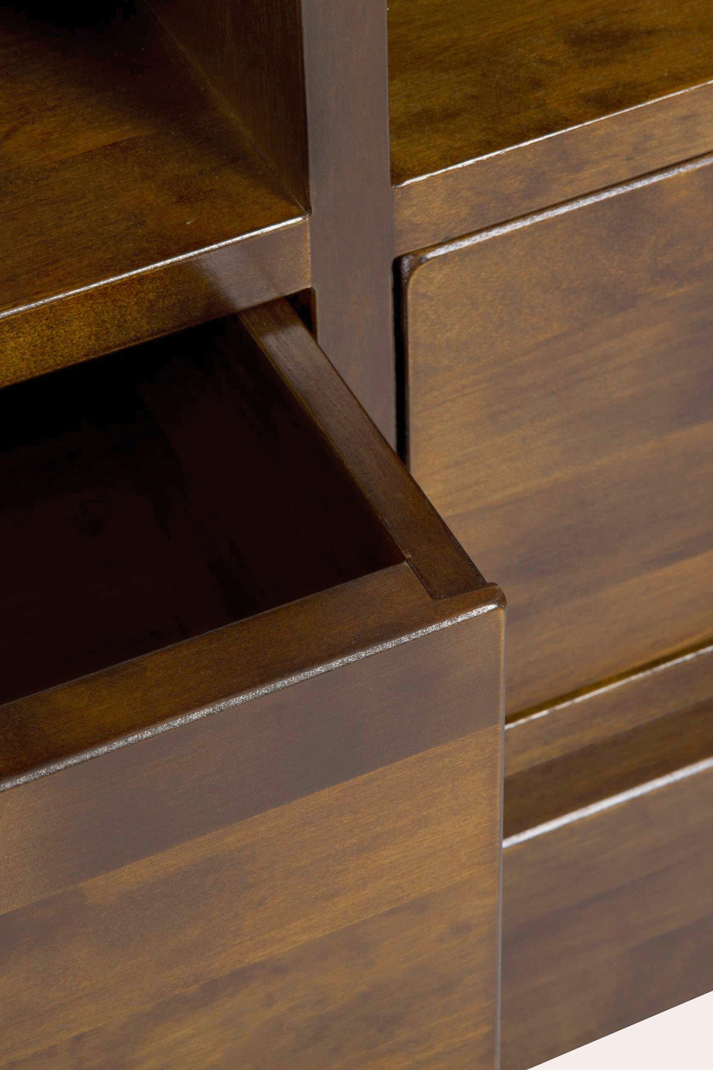 Close-up of a wooden drawer with metal handle.