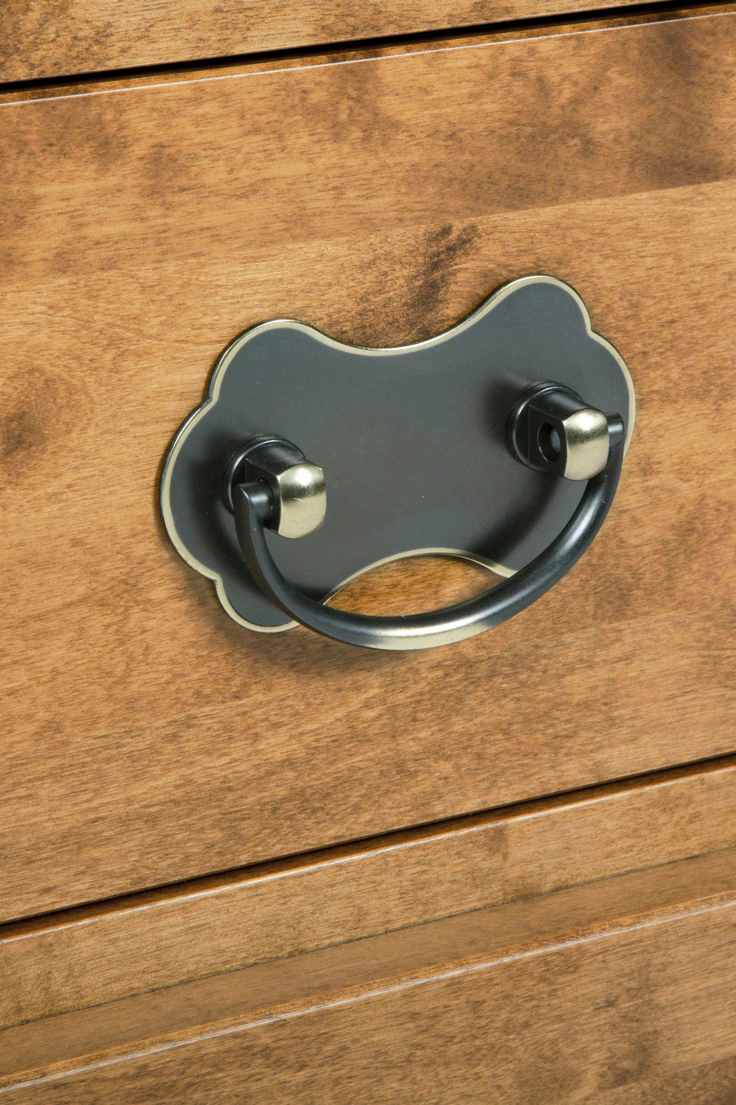 Close-up of a wooden drawer with a metal handle.