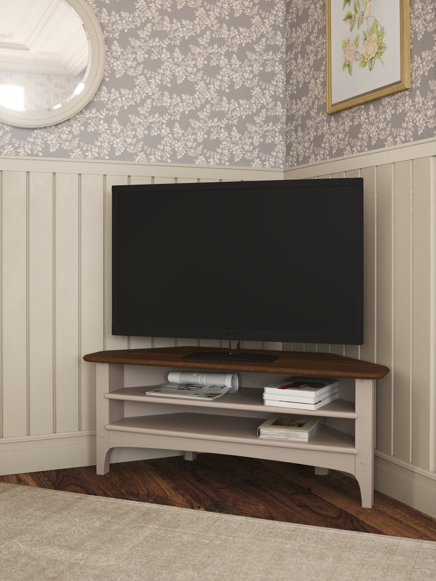 Corner TV stand with a television mounted on a wall with floral wallpaper.