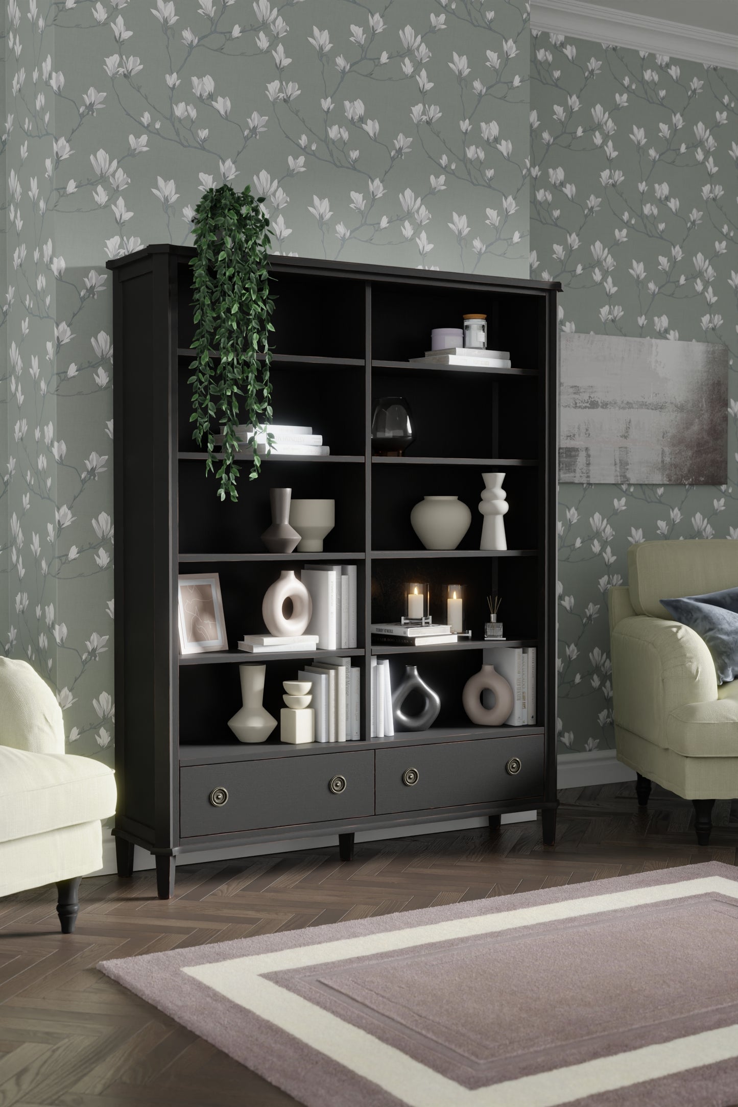 Black wooden bookcase with decorative items against a floral wallpapered wall.