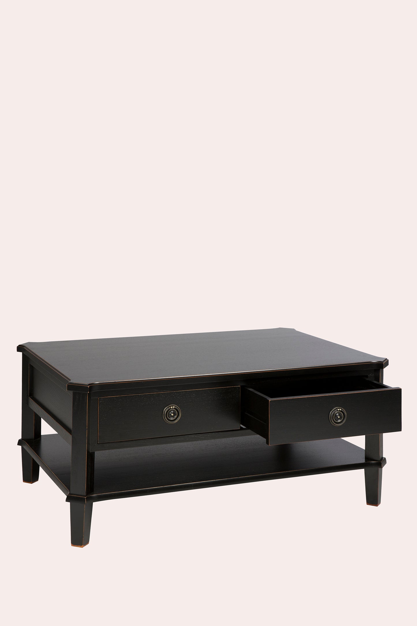 Black coffee table with a drawer on a beige background
