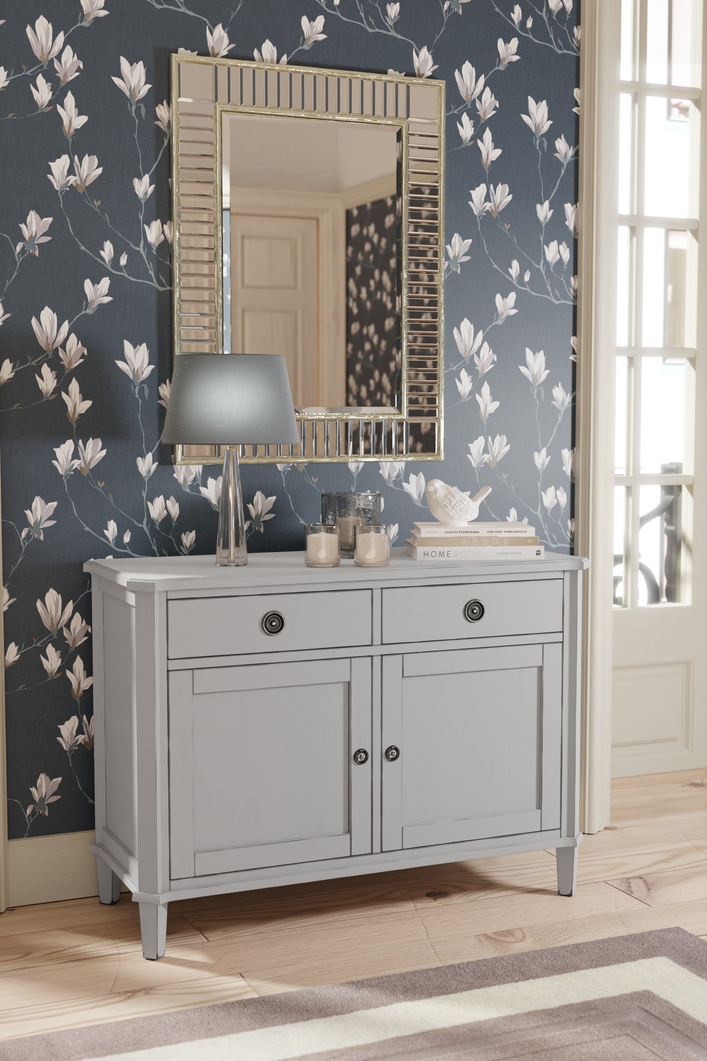 Gray sideboard with mirror against floral wallpaper