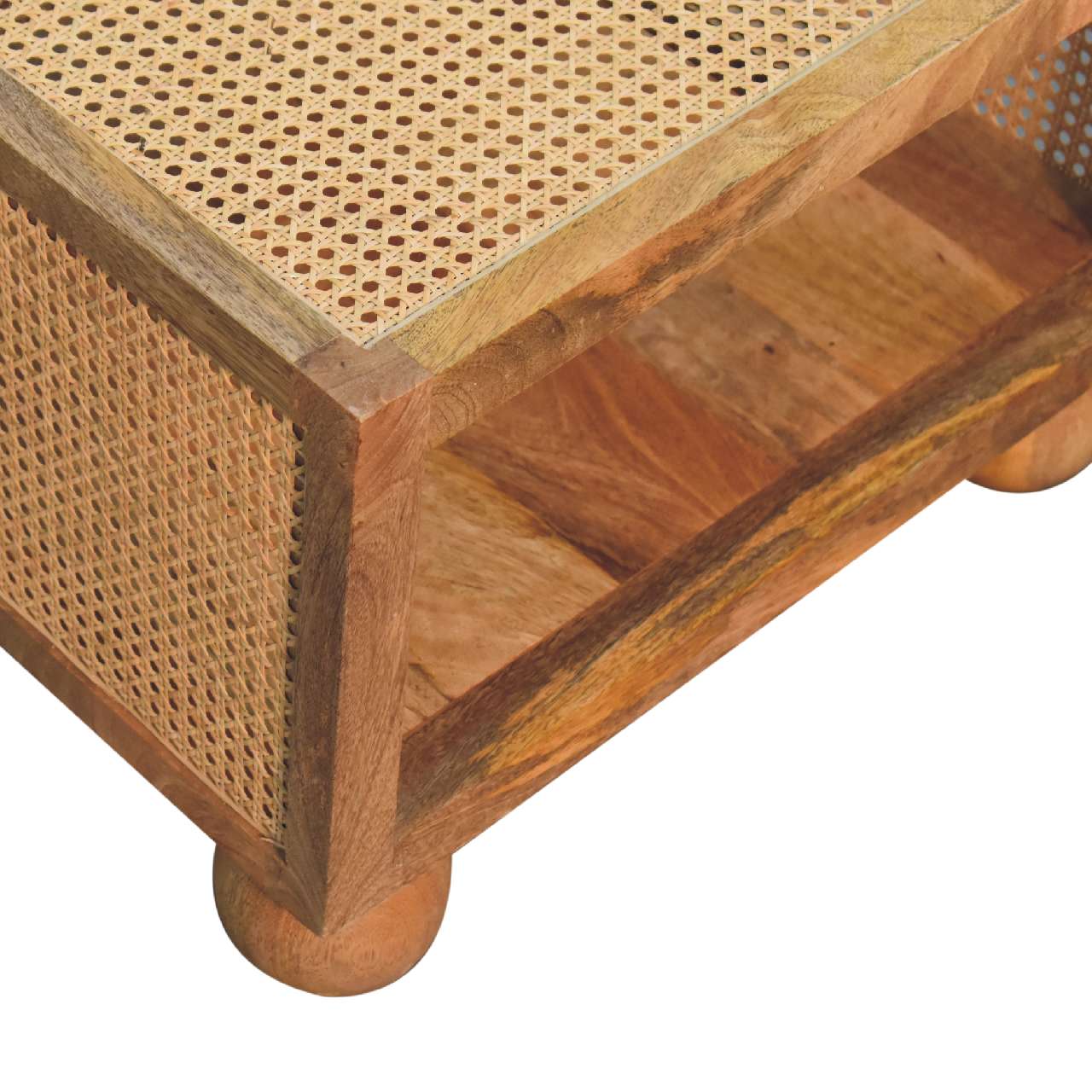 Close-up of the woven rattan panel on the side of a square wooden coffee table, showing the detailed texture.