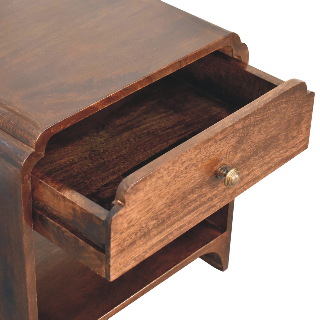 Close-up of the open single drawer with rounded brass knob and curved edging design.
