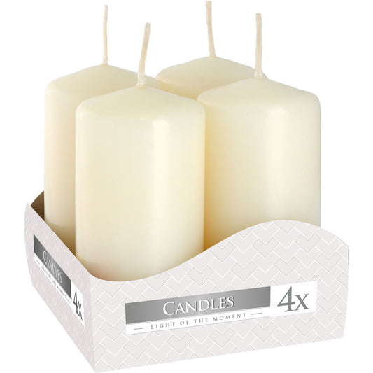 Set of four white candles in a decorative box with 'Candles' branding.