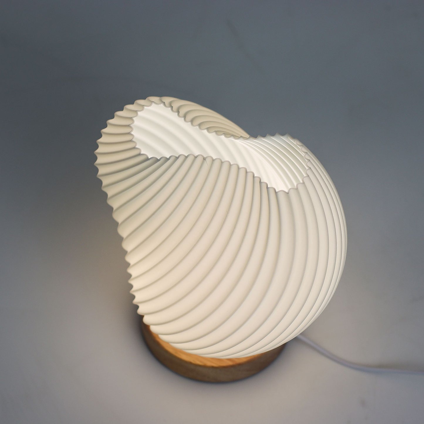 Modern table lamp with a unique design on a gray background
