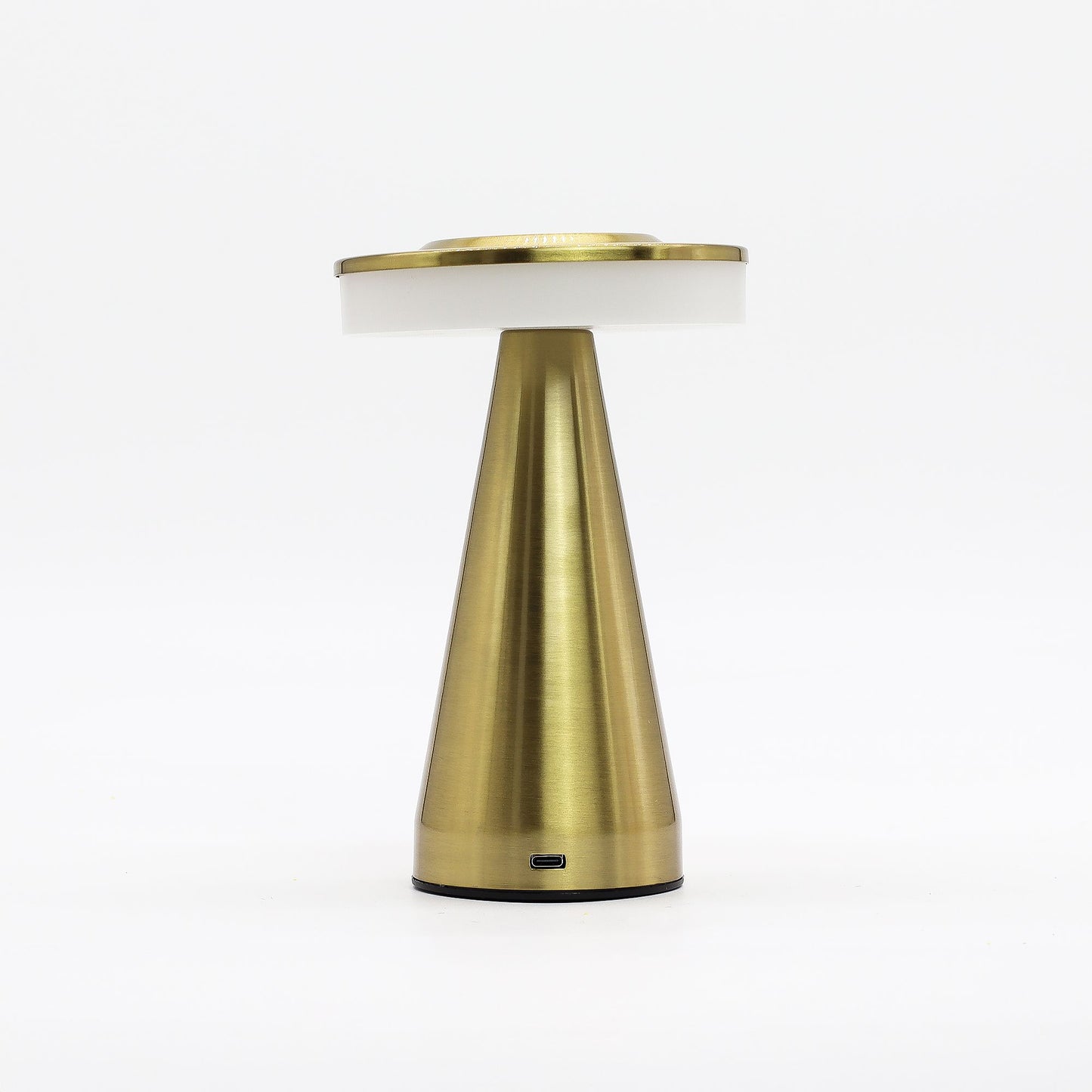 Gold table touch lamp with white shade on a white background