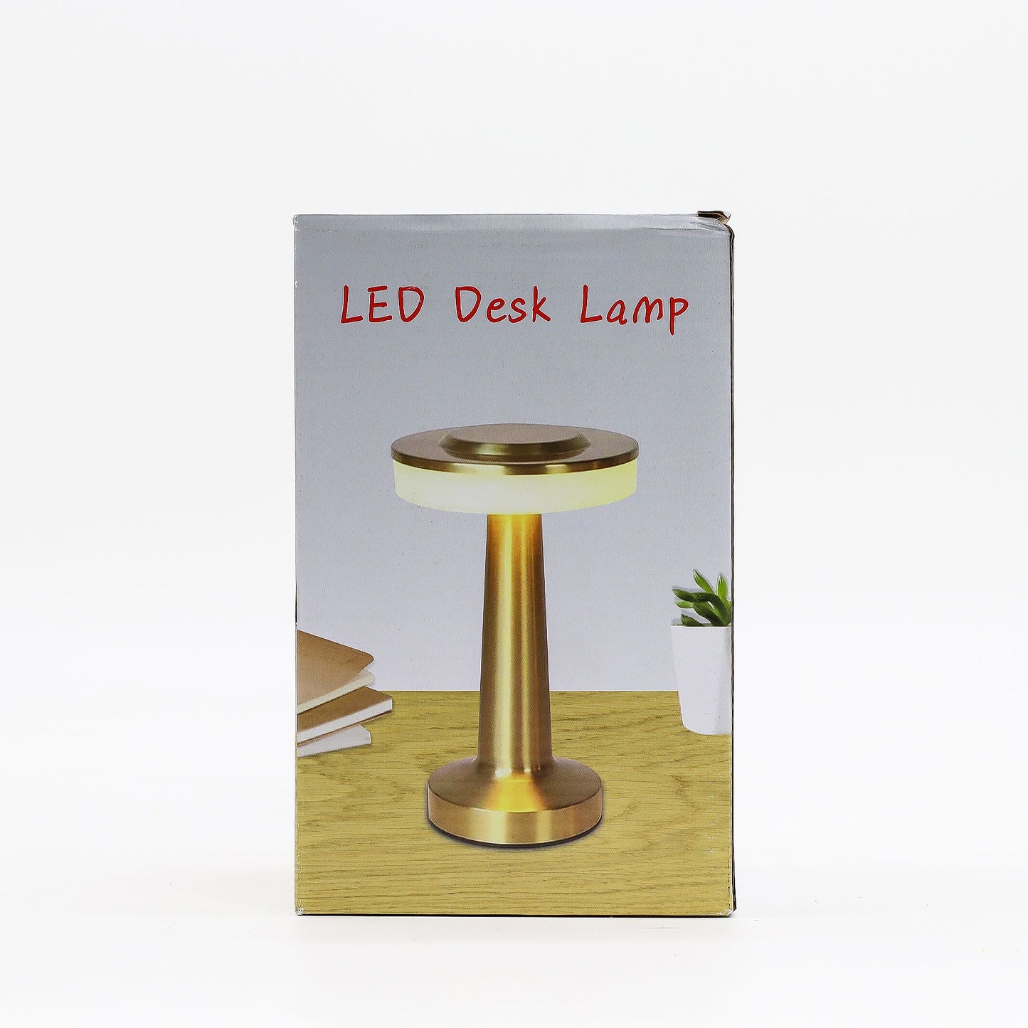 Box packaging of an LED desk touch lamp with a gold base on a white background