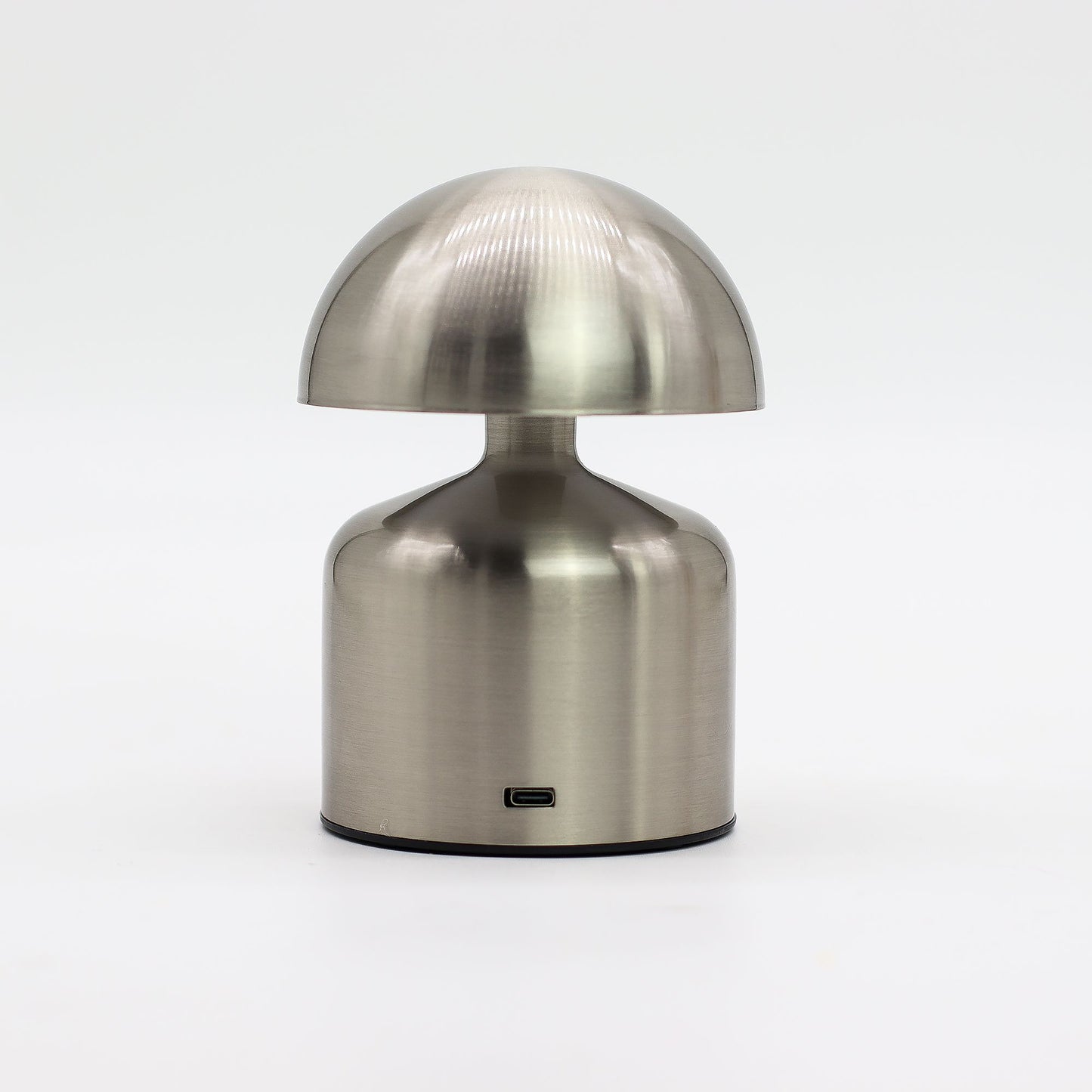 Metallic table lamp with a unique dome-shaped design on a white background