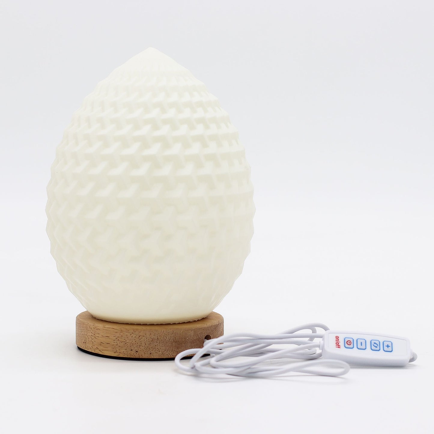 White textured diffuser with wooden base and control cable on a white background