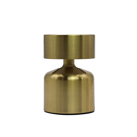 Gold metallic touch lamp on a white background