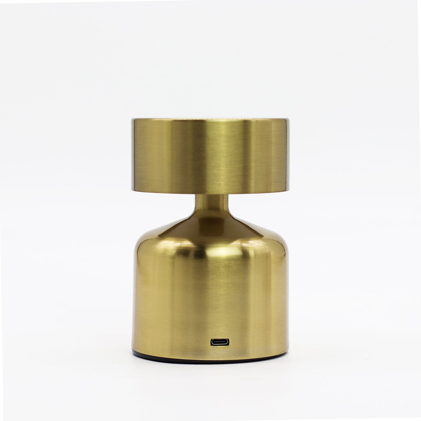 Gold metallic rechargeable table touch lamp on a white background