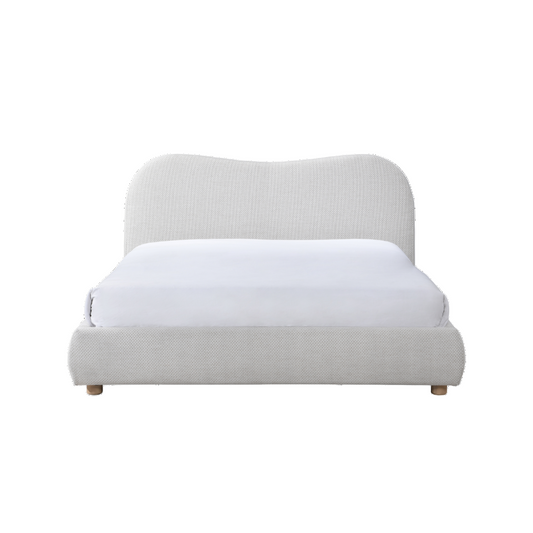 Light gray upholstered bed with white mattress on a white background