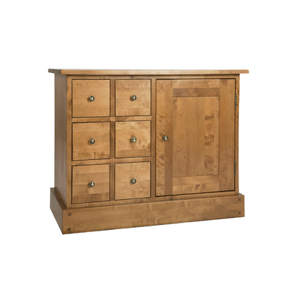 A honey-coloured wooden sideboard with one door and six drawers, with a simple traditional design.