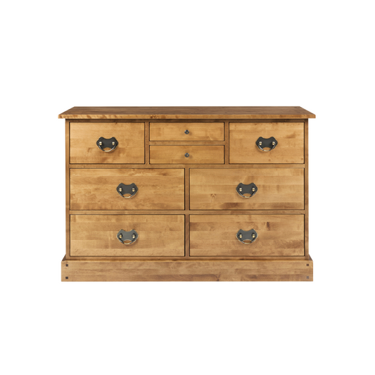 A honey-colored wooden drawer chest with eight drawers, featuring a traditional design with metal handles.