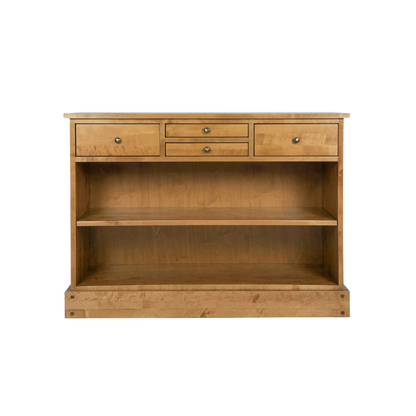 A honey-colored wooden console table with four drawers and open shelves.