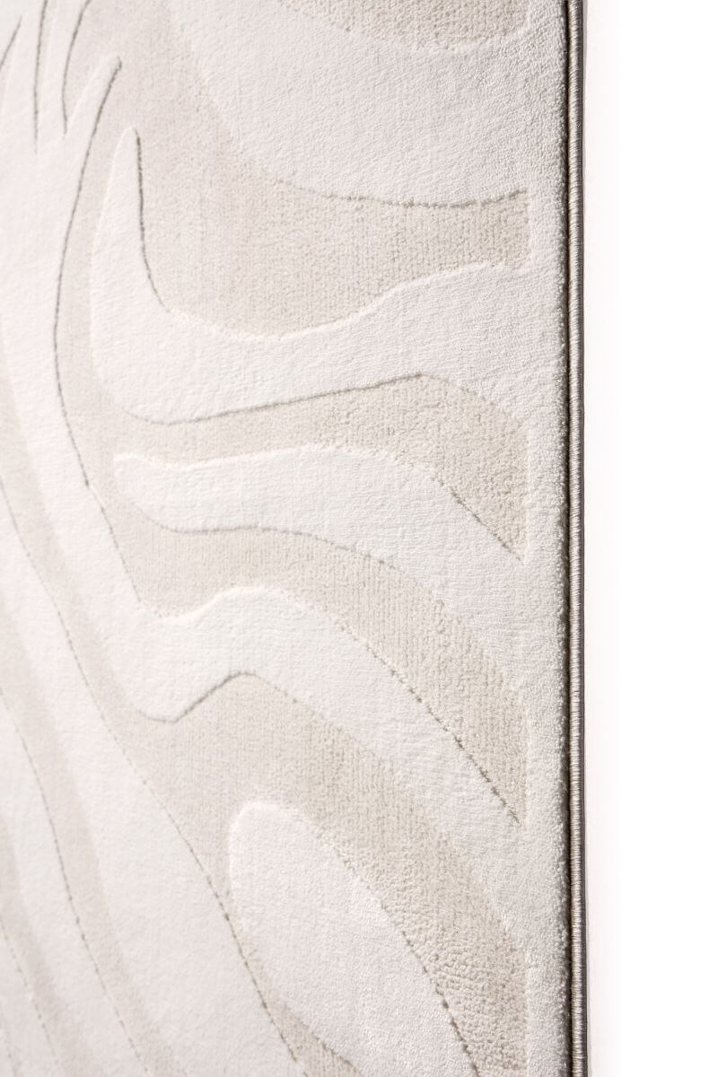 Close-up of a textured white surface with abstract patterns