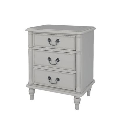 A right-hand corner angle view of a dove grey 3-drawer bedside chest with traditional design and metal handles.