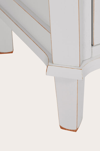 Close-up of a light grey bookcase leg on a white background