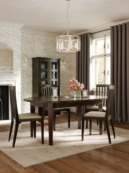Dining room with dark brown oval dining table and 4 dining chairs