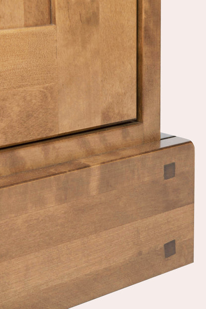 Close-up of a wooden door corner of of a sideboard