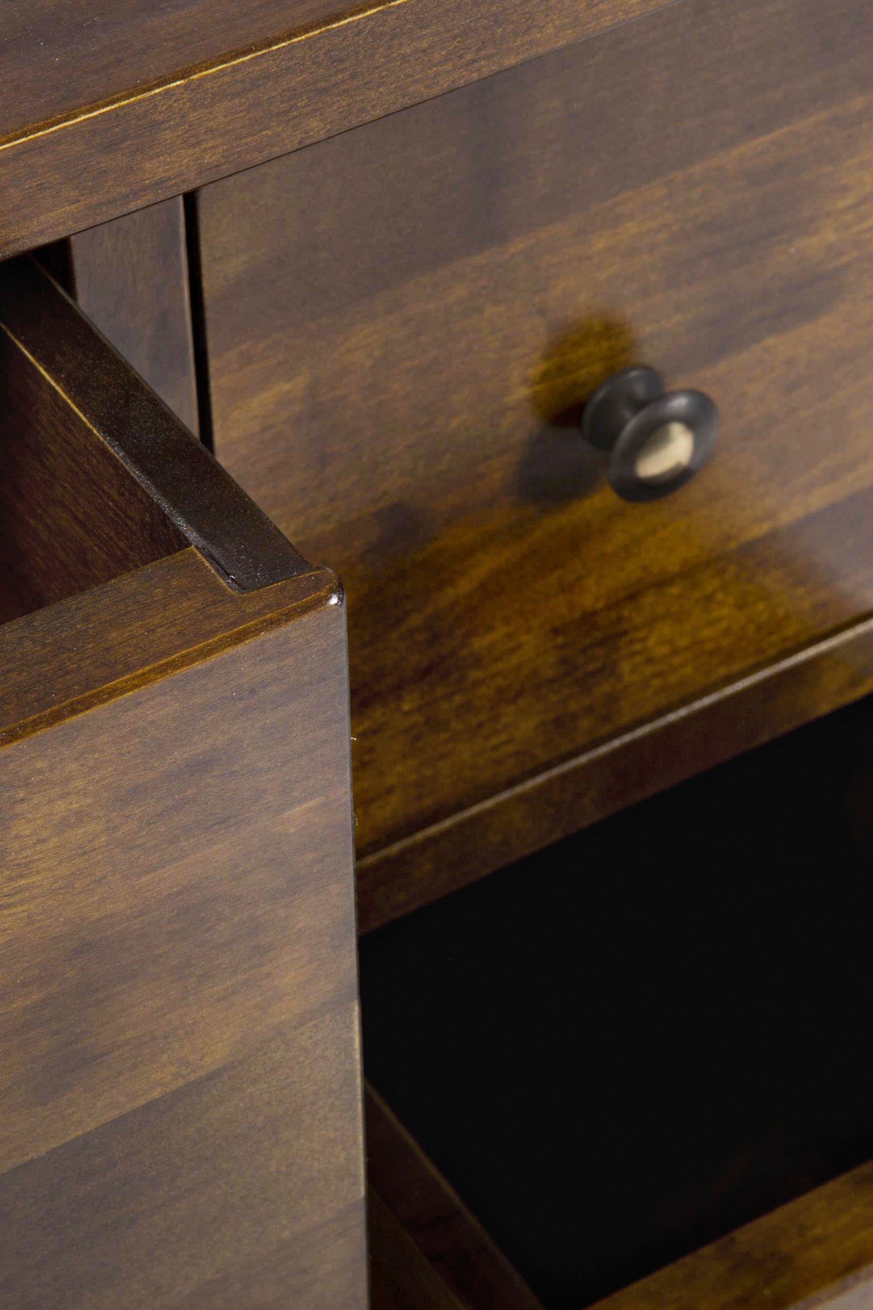 Close-up of a wooden drawer with a knob.