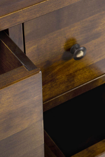 Close-up of a wooden drawer with a knob.