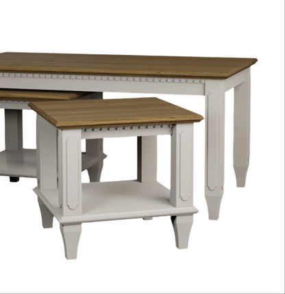 Set of three wooden nesting tables with white base on a plain background