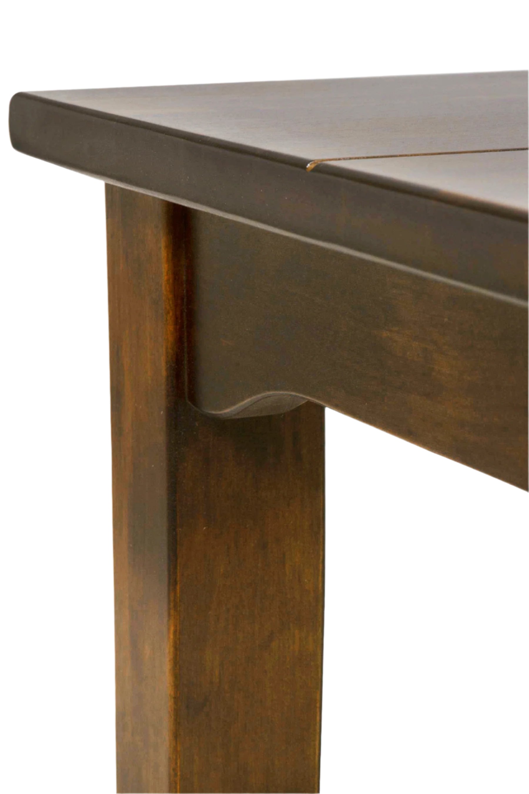 Close-up of a wooden table leg and top.