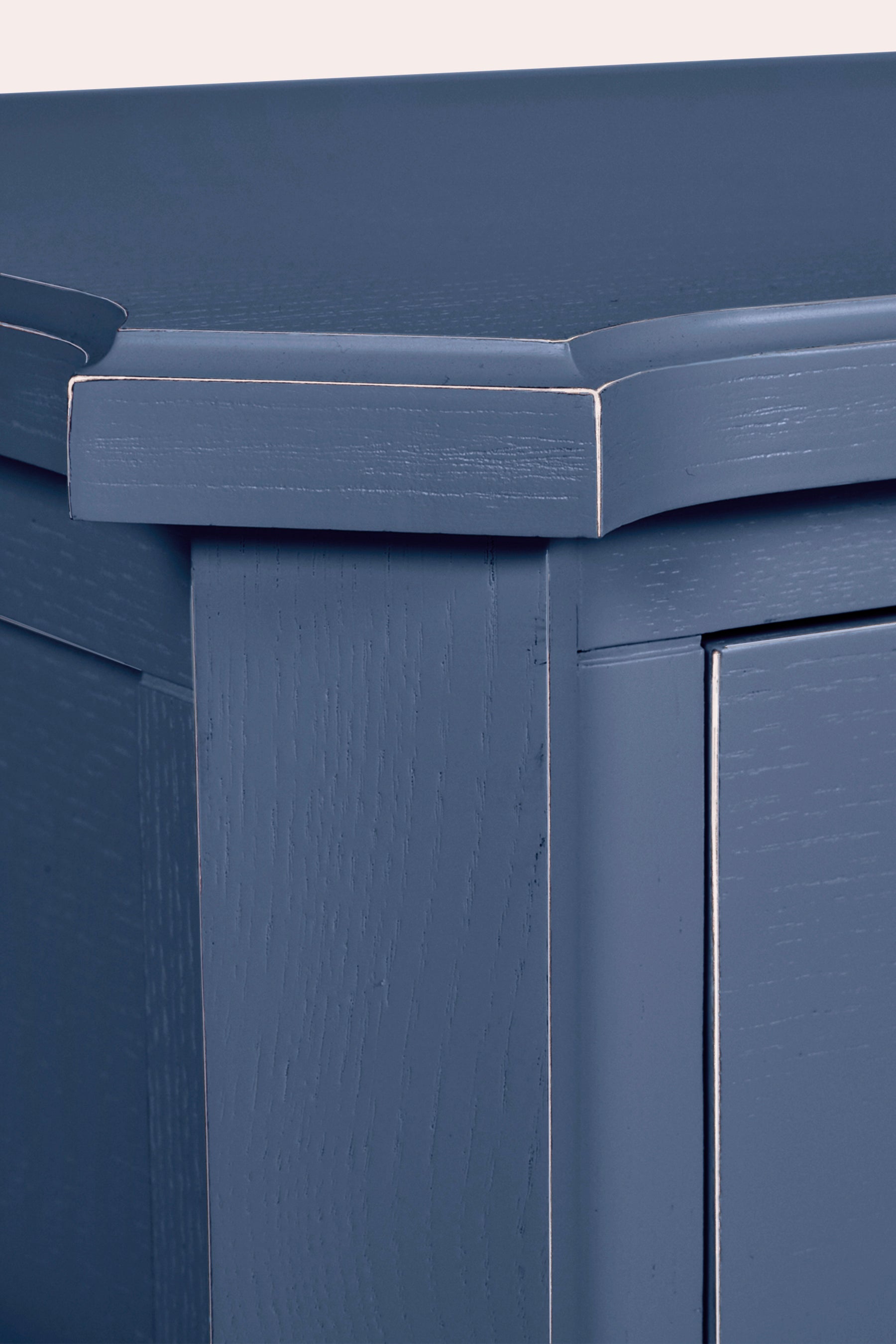 Close-up of a blue storage bin with a metallic handle.
