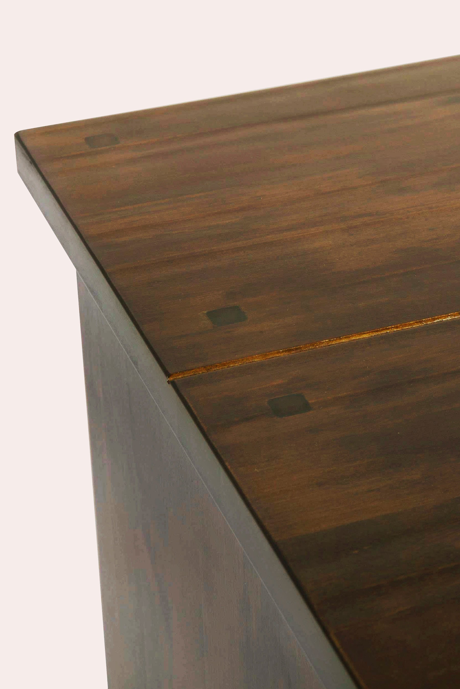 Wooden surface with visible grain and knot details.
