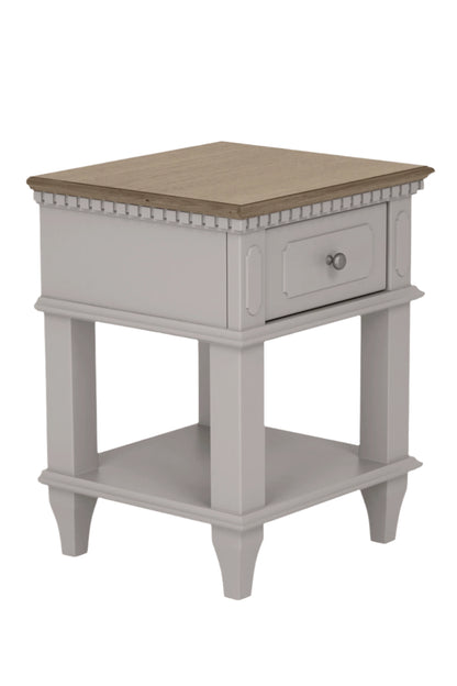 Small side table with a drawer on a plain background