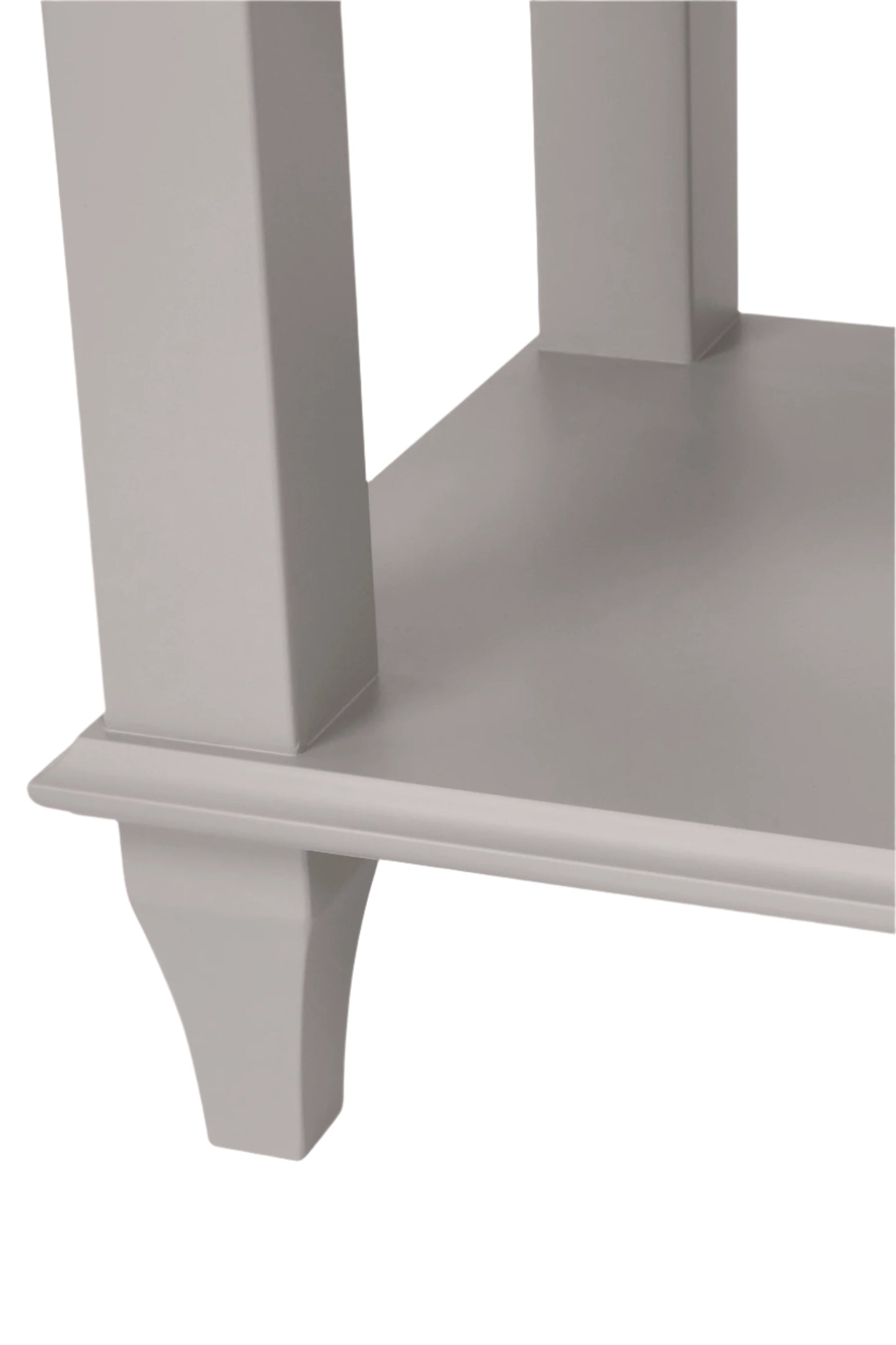 Close-up of a corner shelf unit at the bottom of a side table with a smooth, uniform surface.