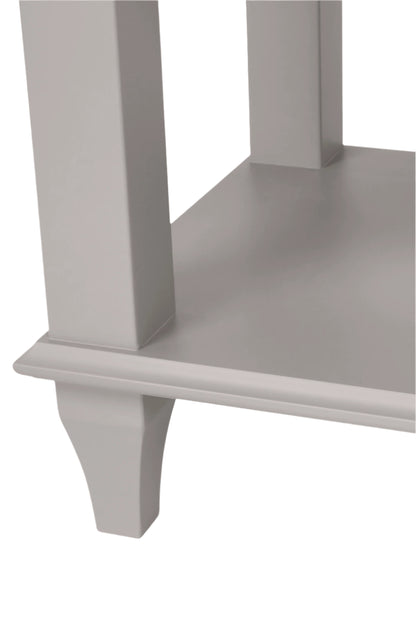 Close-up of a corner shelf unit at the bottom of a side table with a smooth, uniform surface.