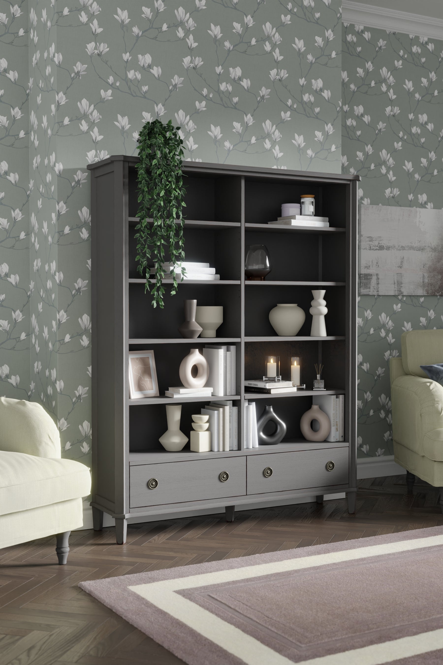 Dark grey bookcase with decorative items against a floral wallpapered wall.