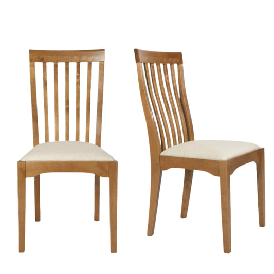 A pair of dining chairs with a honey-colored finish, featuring a slatted backrest and a padded seat.