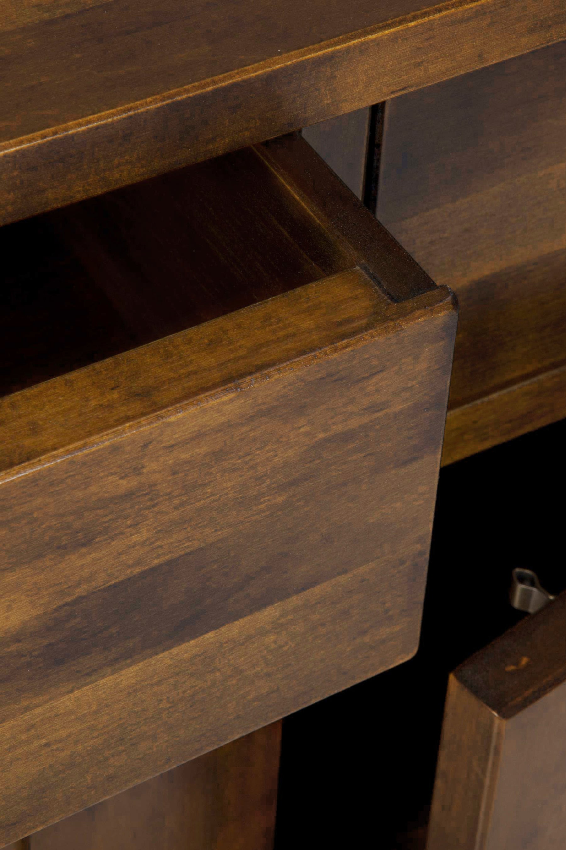 Close-up of a wooden drawer being pulled out.