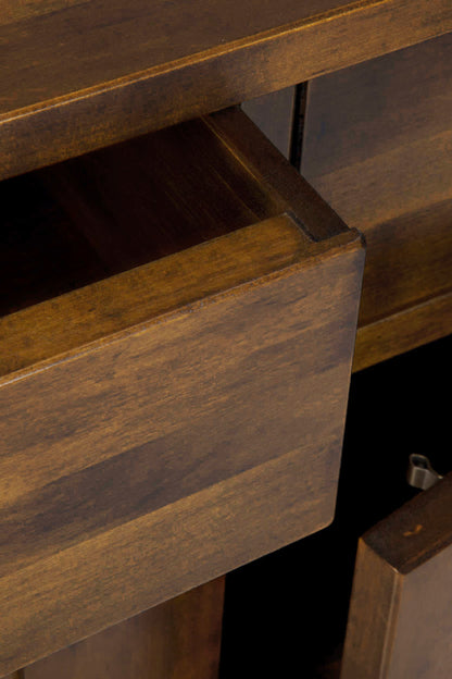 Close-up of a wooden drawer being pulled out.