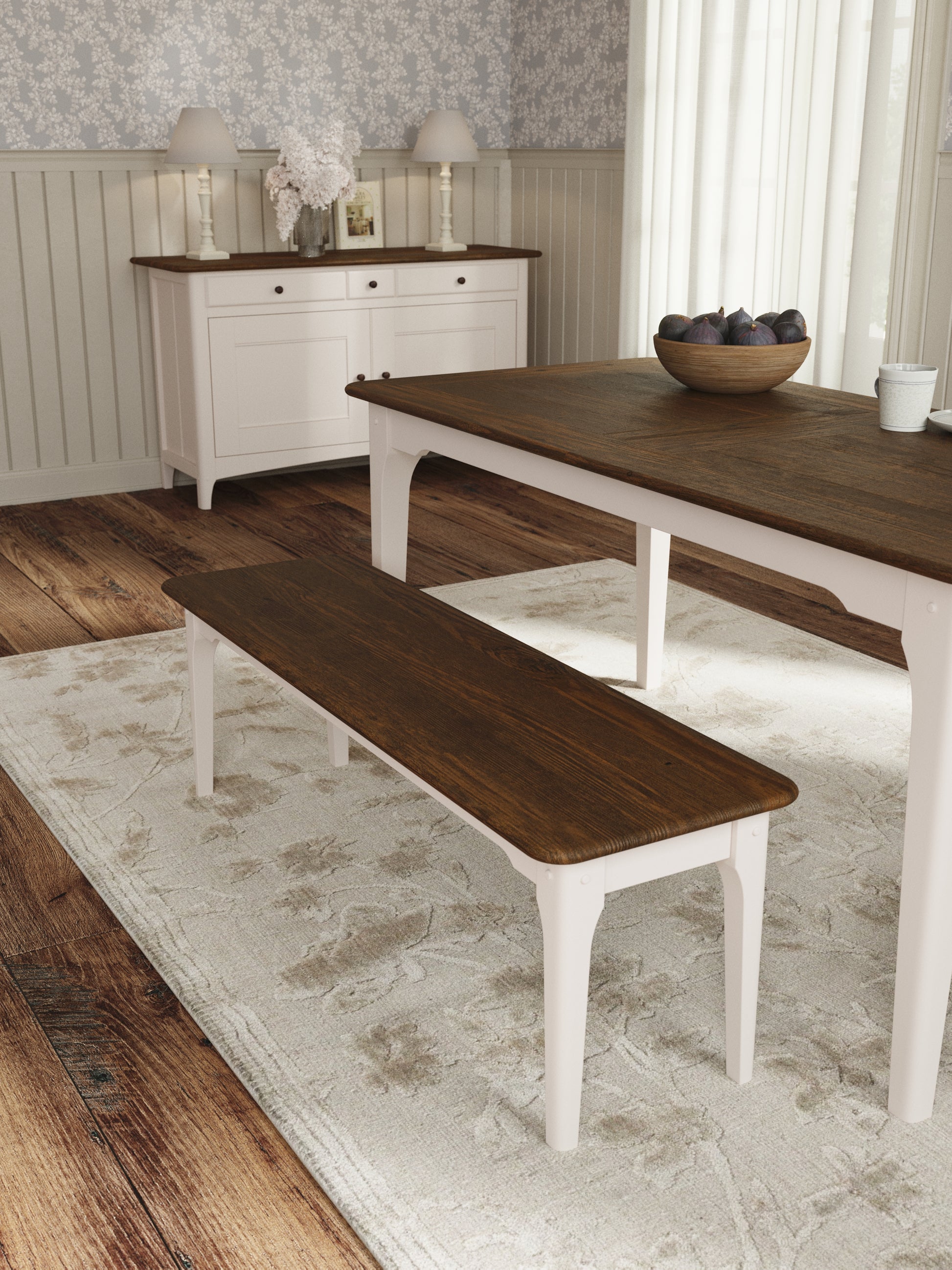 Dining room with wooden table and bench on a patterned rug
