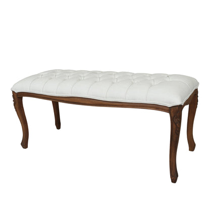 White upholstered bench with wooden legs on a white background