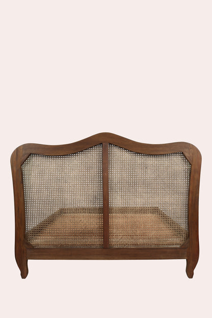 Wooden fireplace screen with mesh design on a beige background
