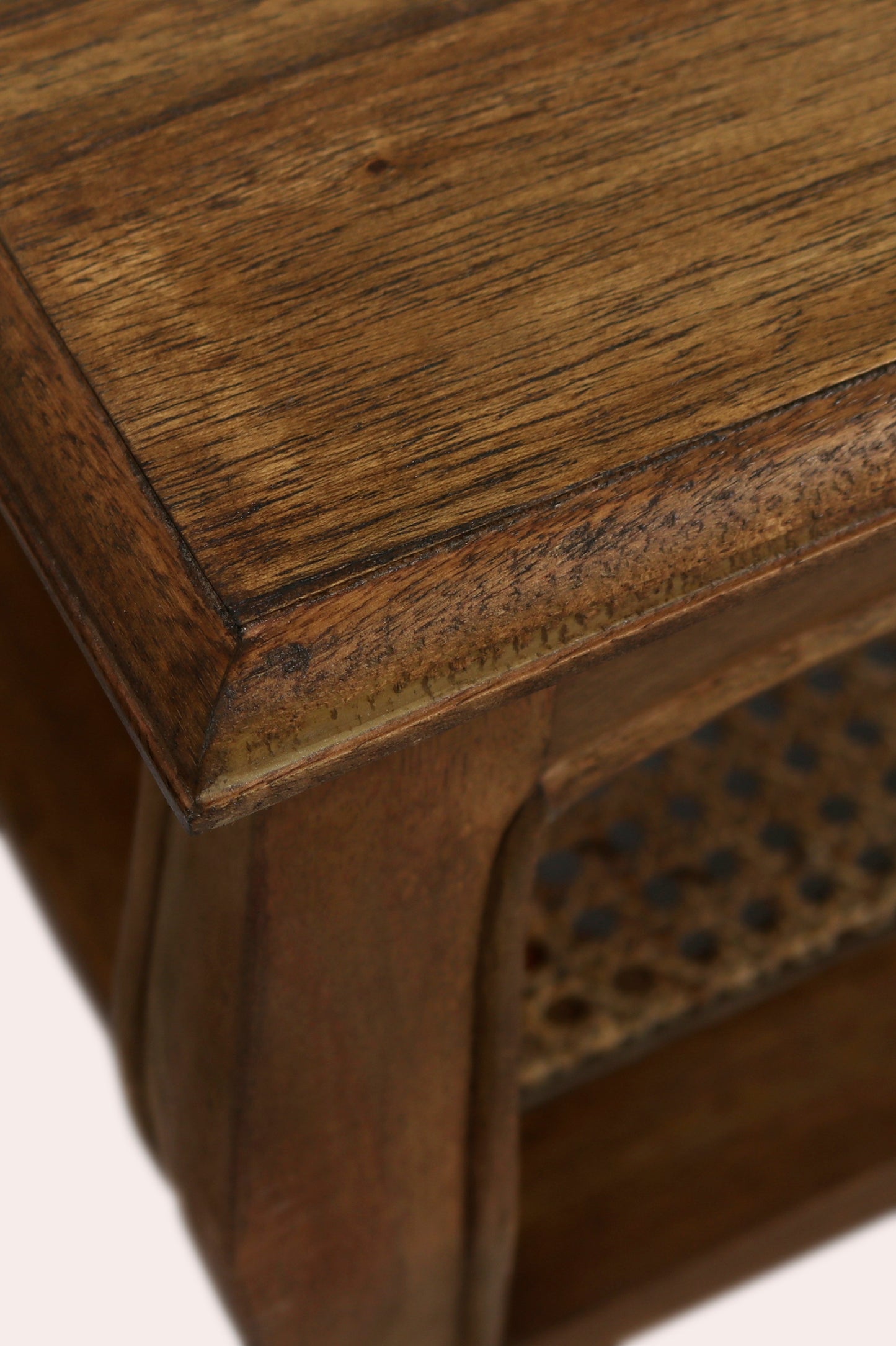 Close-up of a wooden side table with a textured surface