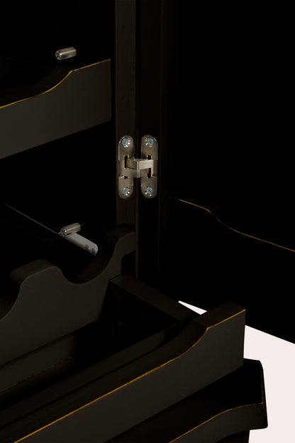 Close-up of a black drinks cabinet with visible hinges.