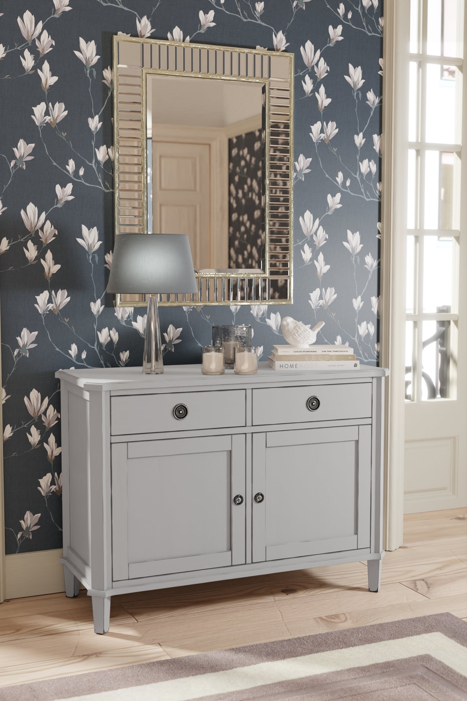 Gray sideboard with mirror against floral wallpaper