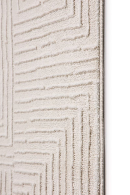 Textured beige carpet with geometric pattern on a white background