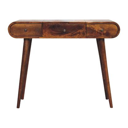 Front-facing view of a wooden dressing table with smooth rounded edges, three small drawers with round handles, and slim tapered legs.