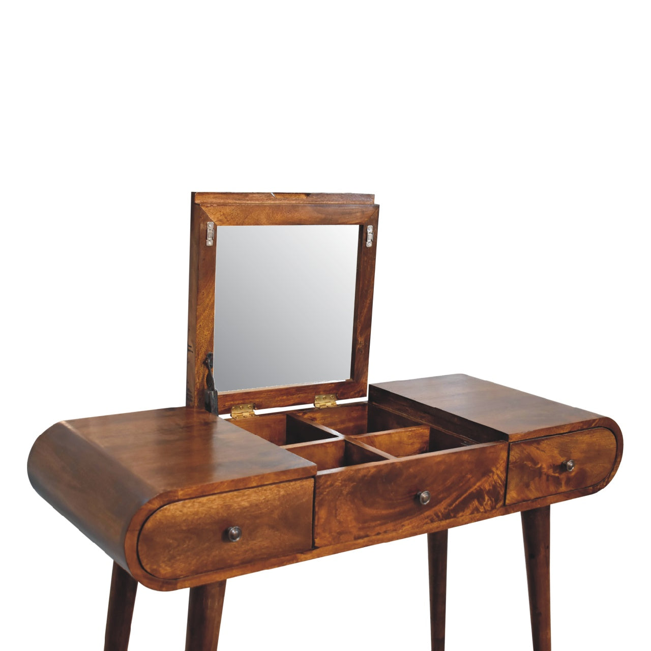 Angled view of a mid-century wooden dressing table with fold-out mirror open, showing internal storage compartments, three drawers with round knobs, and tapered legs.